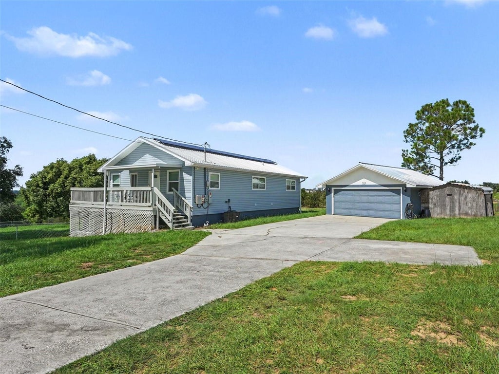 Photo of 705 Lake Ada Boulevard, Dundee, FL 33838 (MLS # TB8547905)