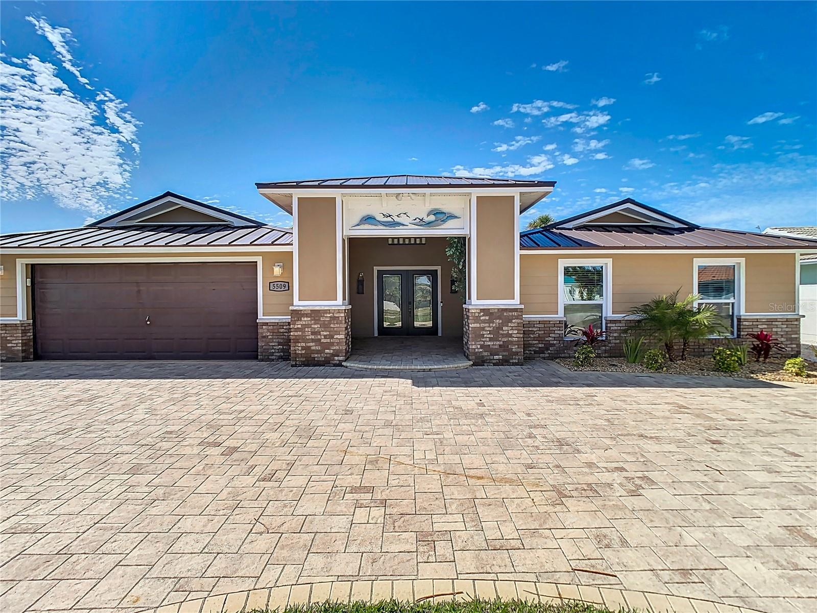From the moment you pull up to this elegant waterfront home you will feel at home!! Huge paver circle driveway and vaulted grand foyer greets you, welcoming you to your own piece of paradise! This 5-bedroom 3-bath pool home features everything you need to enjoy your Salt Life adventures!! 2775 sqft under air makes this one of the larger homes in Gulf Harbors. Stainless Steel appliances, granite counter tops, large living room, Metal Roof was installed in 2019, and a back porch large enough to entertain all of your friends!! 15000-pound lift and a floating dock are ready for your boat! The back porch has a grand sitting area under cover and a large Hot Tub that is included in the sale of this home, along with a swimming pool to cool off while you look over the water and watch dolphins splashing in the canal. Situated on one of the largest canals in Gulf Harbors you will have less than a 5-minute boat ride to the Gulf of Mexico and your off for adventure day. Call today for your private viewing of this amazing home!