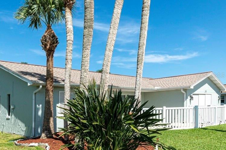 **Seller Offering to Buy Down Interest Rate**
Discover the charm of Old Florida living in this 3-bedroom, 2-bath home with a flex room, ideally located in the heart of Flagler Beach. Just a short walk to both the Atlantic Ocean and Intracoastal Waterway, and minutes from downtown Flagler Beach’s shops and restaurants.
This home offers a desirable split floor plan with a flexible bonus room currently used as a sunroom—perfect for a home office, den, or additional living room. The spacious primary bedroom features two large closets and attractive luxury vinyl flooring. The en-suite bath is functional and ready for renovation to fit your personal style.
The kitchen features new, soft-close cabinetry and connects to the cozy living area with a fireplace, adding warmth and character. Additional features include a large garage with screen and automatic door, washer, dryer, and utility sink, plus an irrigation system powered by well water. Located in a quiet, established neighborhood with no HOA and no CDD fees, this home offers beachside convenience and classic Florida appeal.