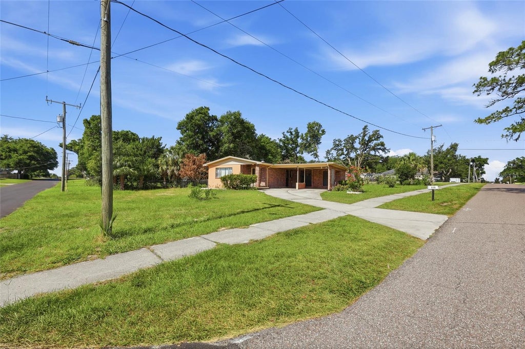 Photo of 620 W Cummings Street, Lake Alfred, FL 33850 (MLS # O6415315)