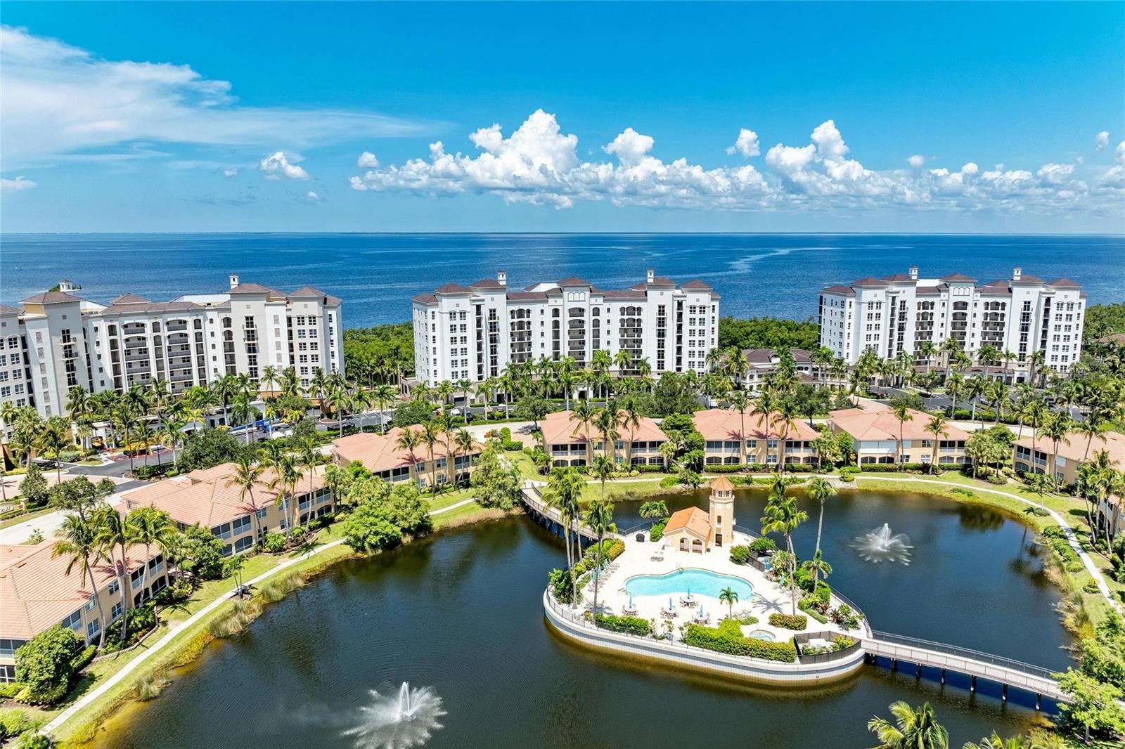 At Grande Isle Towers, the views are nothing short of spectacular—and this 5th-level Tower III residence frames them like fine art. From sunrise to sunset, gaze across the shimmering expanse of Charlotte Harbor and the channel, where sleek yachts glide through deep blue waters and dolphins and manatees surface to play as the evening sky melts into a palette of gold and crimson. It’s waterfront living at its most captivating.
An elegant foyer entry with tray ceiling welcomes you into the expansive great room, where soaring 9'4" ceilings and floor-to-ceiling sliding doors invite abundant natural light and open onto a spacious 20' x 9' screened lanai—perfect for seamless indoor-outdoor living.
The kitchen is a harmonious blend of style and practicality, featuring warm wood cabinetry, sleek solid-surface countertops, and a breakfast bar designed for casual dining or effortless entertaining. A thoughtfully designed wet bar with a wine fridge doubles as a coffee station, ready to energize your mornings or enhance your evenings with ease.
Wake up to sparkling water views in the master suite, where sliding doors open to the lanai for morning coffee in the breeze. Unwind in the spa-inspired bath with a soaking garden tub, seamless glass shower, and dual vanities, plus walk-in and linen closets to keep everything organized. Guests will love the sunlit bedrooms, and bedroom three’s glass French doors flood the foyer with warm, natural light—setting a bright, welcoming tone the moment you walk in.
A tasteful turn-key furniture package will be included in the sale. Secure underbuilding parking space and climate-controlled storage are also included.
The Grande Isle's on-site amenities are just steps from your condo. You’ll find the Grande Salon Club room available for private parties, offering a bar, catering kitchen, plus a private theater room, card tables, and billiards. The well-equipped fitness center, featuring a steam room, dry sauna, lockers, and showers, is open 24/7. Step outdoors to enjoy swimming, sunbathing, or barbecues on the elevated deck overlooking Charlotte Harbor.
Burnt Store Marina & Country Club offers unparalleled amenities for every lifestyle. Tee off on the 27-hole executive golf course, complete with casual dining, a bar, and a pro shop, or embrace an active social calendar with memberships featuring tennis, pickleball, a driving range, and a state-of-the-art fitness center.
Boaters cherish Safe Harbor Burnt Store Marina—the largest deep-water, direct-access marina in Southwest Florida—offering convenient on-site boat rentals through Freedom Boat Club. Just 10 miles from Boca Grande Pass, the “Tarpon Fishing Capital of the World,” and minutes from Charlotte Harbor, a premier sailing destination, your aquatic adventures begin right at your doorstep. Savor waterfront dining at Cass Cay or relax with a casual meal on the Ship’s Store deck—this is waterfront living at its finest. Make it yours today.