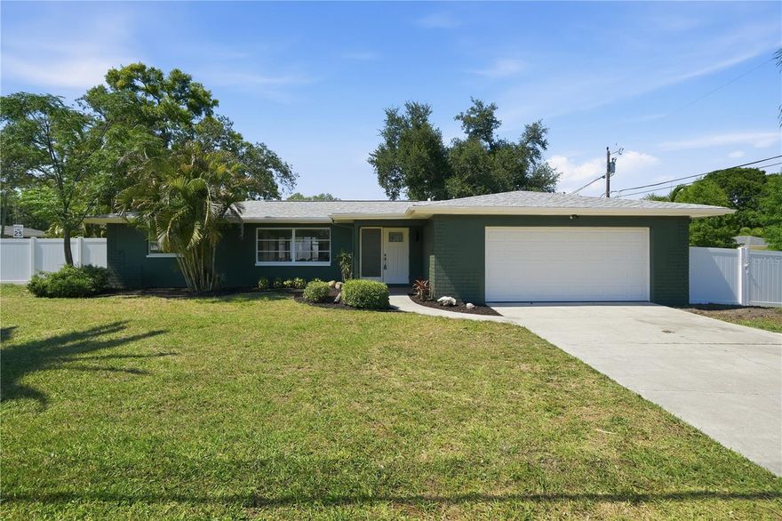 Welcome to 1300 Michigan Blvd, where modern elegance meets the laid-back coastal lifestyle of one of Pinellas County’s most beloved communities—Dunedin.

Perfectly positioned on a spacious corner lot, this beautifully renovated home offers the ideal blend of style, comfort, and location. Step inside to discover a bright open-concept layout where the kitchen flows seamlessly into the main living area, creating the perfect space for entertaining or everyday living.

The heart of the home is the stunning designer kitchen, featuring luxurious Taj Mahal quartz countertops, a full slab island, matching Taj Mahal backsplash, sleek slim shaker cabinetry, and elegant travertine lighting fixtures that add warmth and sophistication. Luxury vinyl plank flooring runs throughout the home, complemented by all-new baseboards, trim, and interior doors for a crisp, modern finish.

Both bathrooms have been tastefully remodeled with beautiful tile selections and upscale finishes, creating spa-like retreats you’ll appreciate every day.

The true split floor plan offers privacy and functionality, ideal for families, guests, or those working from home. Step outside to your fully fenced backyard with brand-new vinyl fencing—perfect for pets, gatherings, gardening, or simply relaxing in your own private outdoor oasis.

And then there’s the location.

Just minutes to vibrant Downtown Dunedin, known for its award-winning restaurants, breweries, boutique shopping, festivals, and golf-cart-friendly charm. Catch spring training baseball with the Toronto Blue Jays at TD Ballpark, bike or walk the Pinellas Trail, or spend the day on the water at the Dunedin Causeway and world-famous Honeymoon Island beaches. You’re also close to Highlander Park & Community Center, featuring pools, tennis, pickleball, fitness amenities, playgrounds, and year-round recreation.

Few places offer the character, walkability, and coastal energy that Dunedin does—and few homes offer this level of finish at this price point.

1300 Michigan Blvd isn’t just a home—it’s a lifestyle.