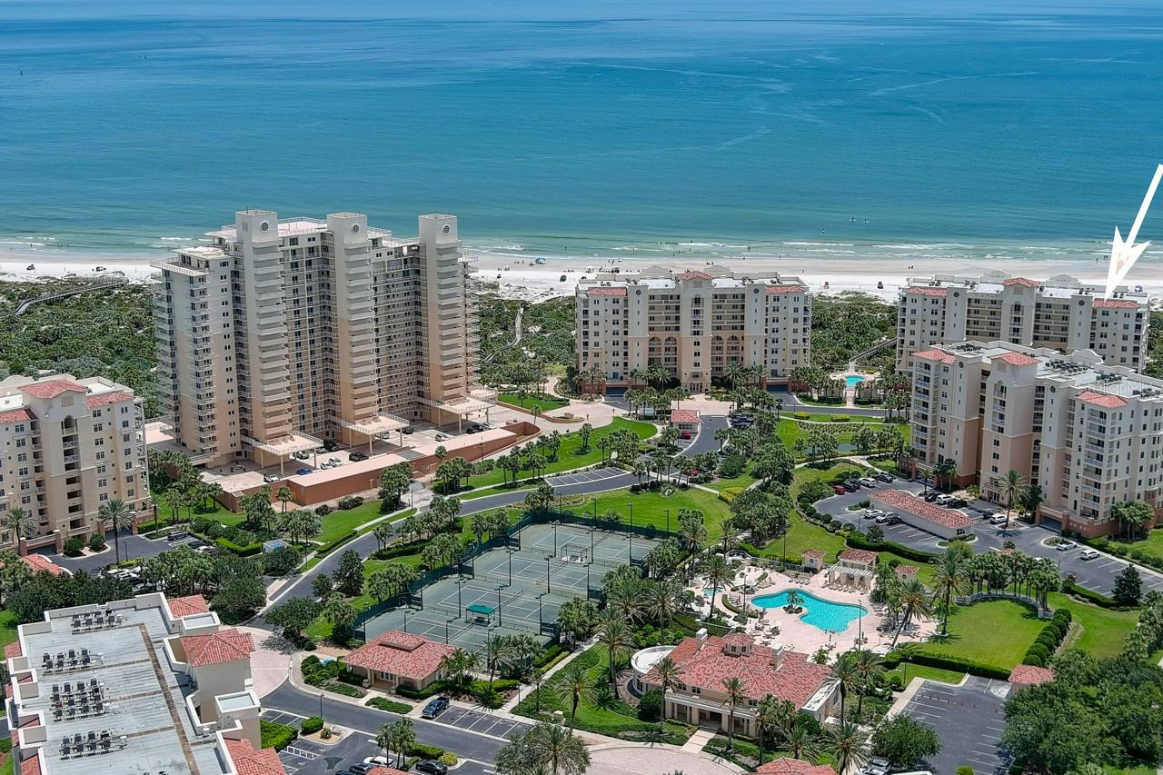 Welcome to paradise in this spectacular direct oceanfront condo situated in the First Class Minorca Resort surrounded by fabulous views of the Ocean, the beach & the Indian River! This 4BR/3BA Coquina floor plan is a corner unit with 2,620 ft. of living area & two spacious balconies to watch the glorious sunrises & sunsets! Situated on the 5th floor, the southeast facing balconies capture the elegant curvature of the white sandy beach & offer the perfect spot to watch the rockets lift off from Kennedy Space Center. Private pavered pool, spa, BBQ grills & handicap walkway to the beach! Gourmet kitchen features top of the line appliances, a breakfast nook, granite counters, 2 pantries, a spacious island with bar stools & opens to a large balcony. Entertaining is easy & ready to enjoy in this turn key breathtaking condo beautifully furnished. This condo includes a convenient underground parking spot #37 as well as a private storage closet on the same floor, great for golf clubs, beach & fishing gear. Floor to ceiling sliders & lots of windows provide plenty of natural sunshine. Luxurious tiled bathrooms are tastefully appointed & the Master Bath has a step-in shower, garden tub and double vanities. Monthly fee of $1,469 includes maintenance of this building & use of all Minorca amenities. Pet friendly allowing 2 pets up to 80lbs and Smyrna Dunes Park next door has a doggy beach. This world class resort features a gorgeous clubhouse with catering kitchen, card tables, pool table, saunas, fitness center w/TVs, pool, spa, BBQ grills, 4 lighted tennis courts, 24 hour gated secured entry, private gated access to the oceanfront pavilion and beach, as well as gated entry to the 64 boat slip marina. Boat slips & docks are available for purchase & are great for fishing, crabbing and watching the dolphins and sunsets. Enjoy the riverfront gazebo with bathrooms, ping pong table & grills for BBQ's & racks for kayaks & paddleboards. Short walk or bike ride to Flagler Avenue Shops & restaurants and only 1 hour drive to Orlando. Don't miss this rare opportunity to live the Florida lifestyle today!