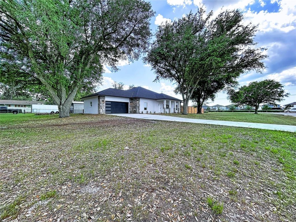 Photo of 32502 Greenwood Loop, Wesley Chapel, FL 33545 (MLS # TB8498000)