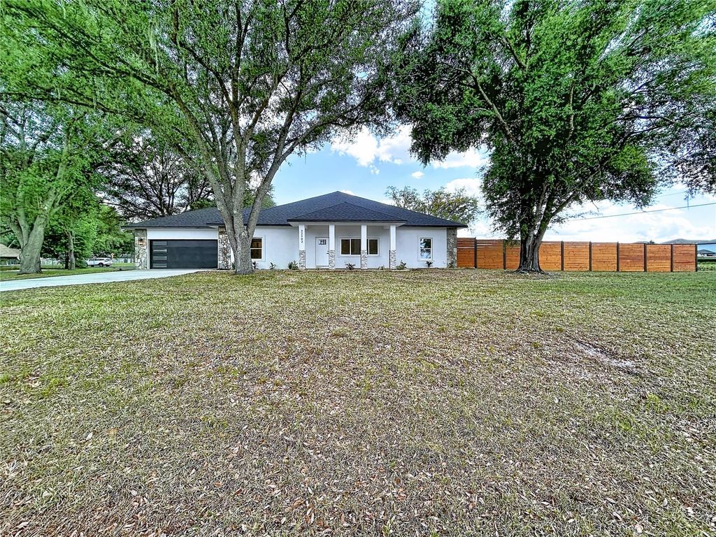 Photo of 32502 Greenwood Loop, Wesley Chapel, FL 33545 (MLS # TB8498000)