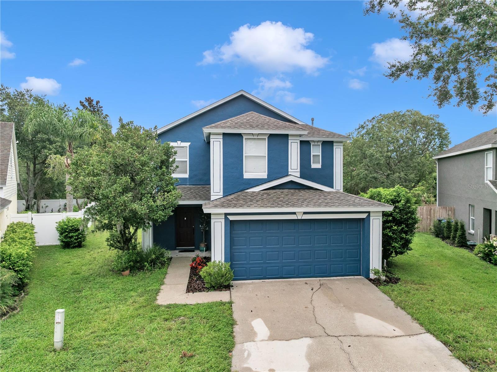 This Beautiful Cardel built 4 bedroom, 2.5 bath , 2-car garage home is on an oversized pie-shaped conservation area lot and located in the heart of FishHawk Ranch! Delightful eat-in kitchen with stainless steel appliances, including a chef's preferred gas range and wood cabinets. The master bedroom is located on the first level with a fantastic en-suite bath with a barn door entry, garden tub, double sinks and separate shower stall. Enjoy the ease of having ceramic tile and wood laminate thru-out this home. Soaring cathedral ceilings make this home feel larger than 1,552 square feet and features several ceiling fans along with crown molding. Enjoy the screened rear patio with peaceful views of the conservation buffered large backyard! There is room to add a pool if so desired. This home offers re-claimed water irrigation system, security system, newer roof and A/C both 2021 and exterior was painted in 2022. This home is located within walking or biking distance to Bevis Elementary. Enjoy the use of the Osprey and Aquatic Clubs, fitness centers, numerous pools, tennis courts, skate park, miles of walking or biking trails and Park Square shops. Don't wait, call today!