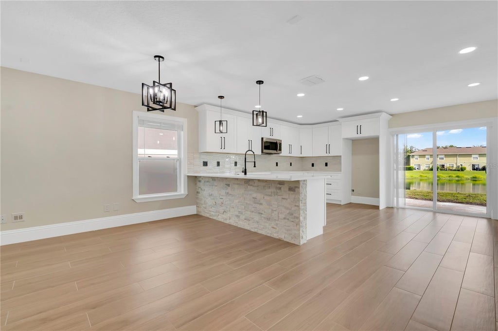 Photo of 531 Flower Fields Lane, Orlando, FL 32824 (MLS # O6438823)