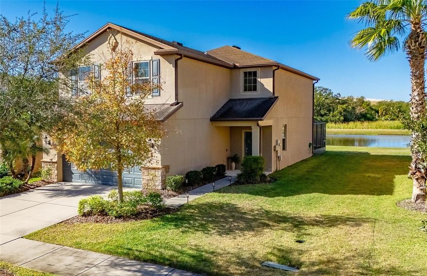ENJOY SUNSET OVER A TREE-LINED POND from the screened and stone-pavered lanai behind this surprisingly large home in gated Magnolia Park! With no back neighbor, plus a yard extra-wide along one side, this property has advantages even beyond its spacious design and quality community! In nearly 3,600 total square feet, you get the 340-SF lanai, a 2-car garage 20% bigger than usual, 3 bedrooms, 2.5 baths, a downstairs office, upstairs family room, and impressively open kitchen / dining / living rooms overlooking the water. The kitchen includes an island with bar seating, while the owner's suite provides a huge walk-in closet and extended shower. Amenities include granite, wood, tile, stainless-steel appliances, undermount sinks, and a beautifully wrought banister / balustrade that enhances the center of the home. You'll find a security system, smart thermostat, water softener, in-wall pest control, hurricane shutters and more. Oh, and you can relax about yard work because it's covered by your HOA in Magnolia Park -- which also provides gated security as well as recreation facilities that include parks, playgrounds, a splash pad and 3 pools! The neighborhood is close to countless conveniences such as schools, shops, restaurants, and key transportation routes. You want to live here!