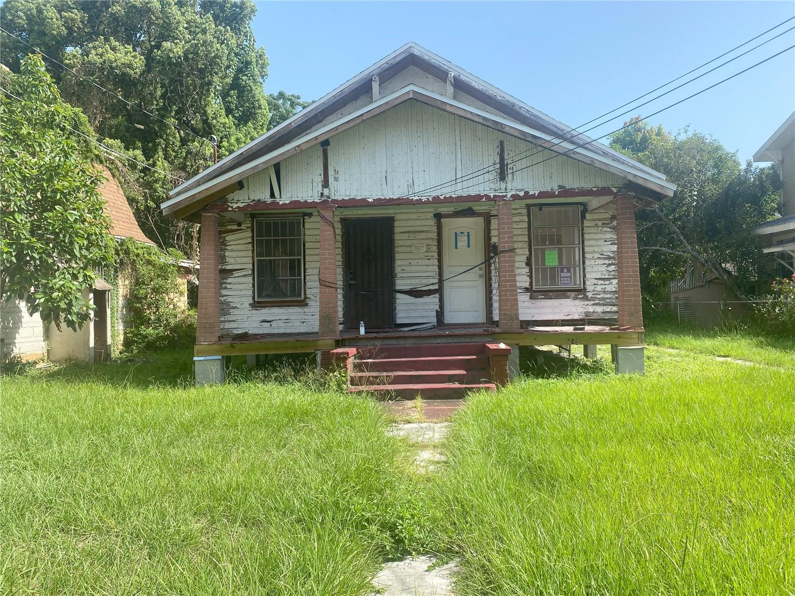 INVESTOR SPECIAL – CASH/HARD MONEY. This home is in need of a COMPLETE renovation or tear down. Foundation was done in 2022 by seller (permitted) and the previous owner did the roof in 2020 (permitted). Electrical panel and meter were replaced in 2018 (permit expired).
Located in the Historic Ybor district. Large YC-8 lot with plenty of room to add a garage with In-Law Suite. Finish the renovation or tear it down and build new.
PERMIT/CODE VIOLATION CONVEYS and BUYER WILL BE RESPONSIBLE FOR CLEARING. Property is being sold with open code violations. COD-20-0002501 and DMO-19-0000115. See attached hold harmless and Violation information.
MIN of $5000 NON-REFUNDABLE deposit due with contract. BUYER/BUYERS AGENT to do their DUE DILIGENCE. BUYER TO INSPECT BEFORE SUBMITTING OFFER - ZERO DAY INSPECTION.