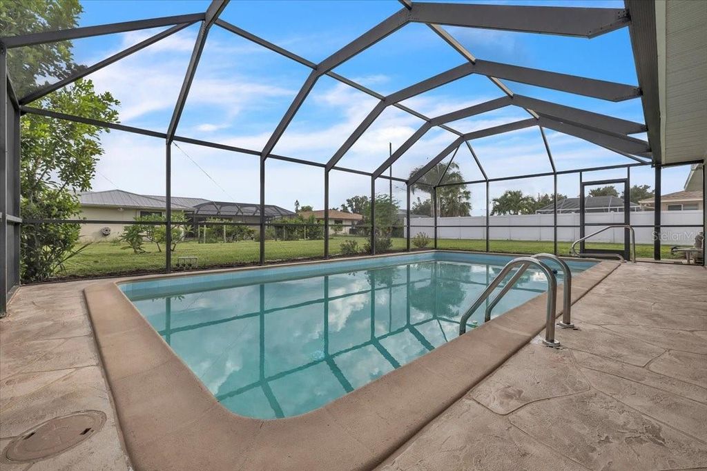 Photo of 907 Sidney Terrace NW, Port Charlotte, FL 33948 (MLS # C7515126)