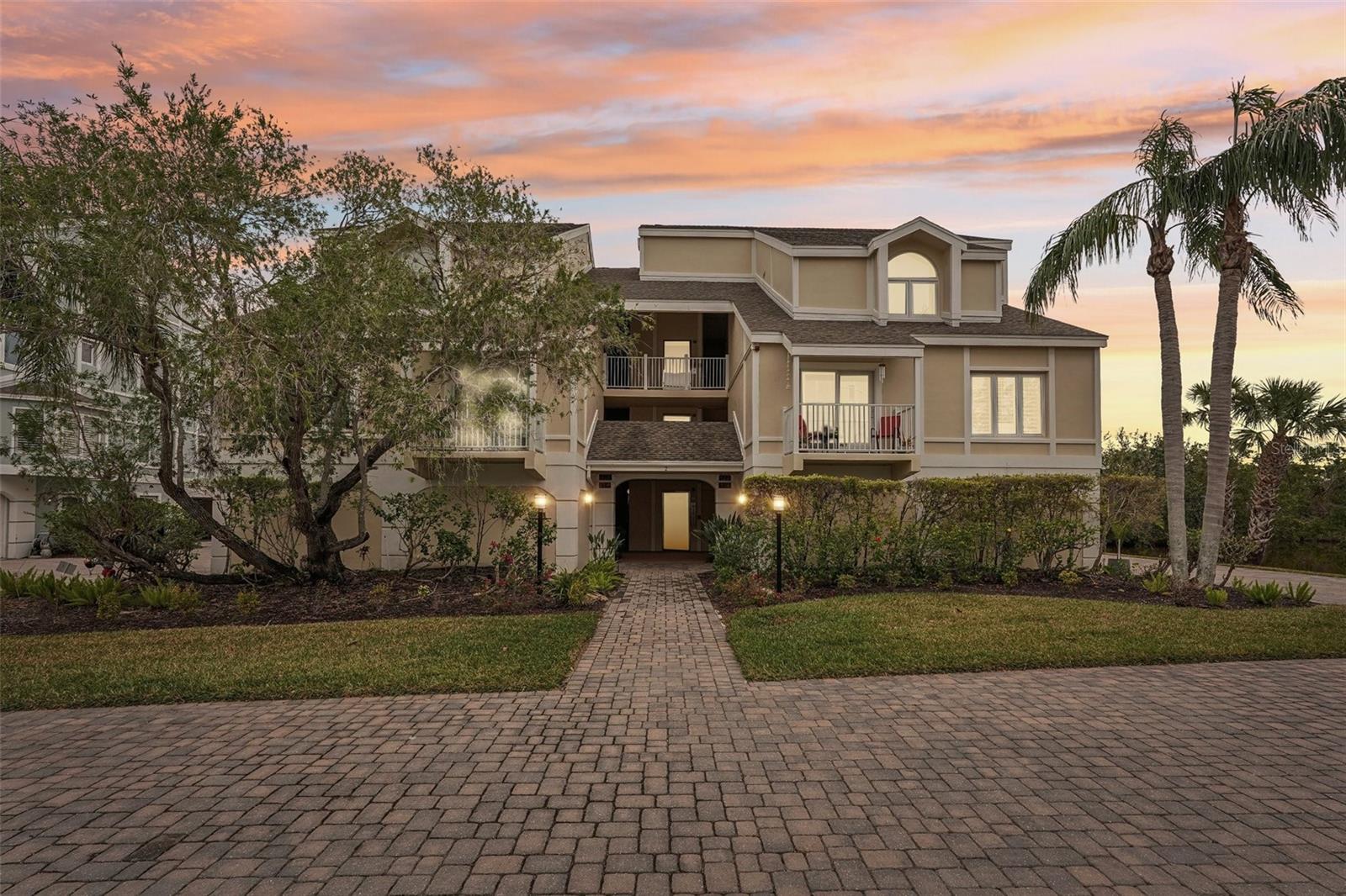 PRICE IMPROVEMENT! Located in the idyllic private enclave of Tidy Island, experience the perfect blend of luxury and nature in this 3-bedroom, 2-bathroom End Unit with water views. The open-concept design provides a generous living area with fireplace, perfect for both relaxation and entertaining. Large windows bathe the interior in natural light and views to the estuary on two sides. The converted Florida room with mini-split offers year round use where you will enjoy unobstructed views of the estuary and daily visits from beautiful white ibis or pink roseate spoonbills. The well-appointed kitchen features contemporary appliances including a new refrigerator in 2022 and ample storage along with a breakfast nook. The master suite offers a tranquil escape with an oversized en-suite bathroom, while two additional bedrooms provide flexibility for guests or a home office. Tidy Island is a private island community with nearly 85% of its 240 acres dedicated to a preservation and wildlife sanctuary. Residents enjoy access to two inviting pools, hot tubs, Har-Tru tennis courts, clubhouse, newly renovated fitness center, meeting spaces, walking trails, boardwalks, community maintenance, 24-hour security guards, on-site maintenance team and property management, landscaping and grounds care, unit exterior care (with new roofs done in 2021), pest control, Wi-Fi, cable, water, trash, and shoreline preservation, all set against the backdrop of Sarasota Bay. While offering seclusion, Tidy Island is conveniently located near the cultural attractions and dining options of downtown Bradenton and the pristine beaches of Anna Maria Island. This property is a testament to refined island living, offering a unique opportunity to own a piece of paradise on Florida’s Gulf Coast.