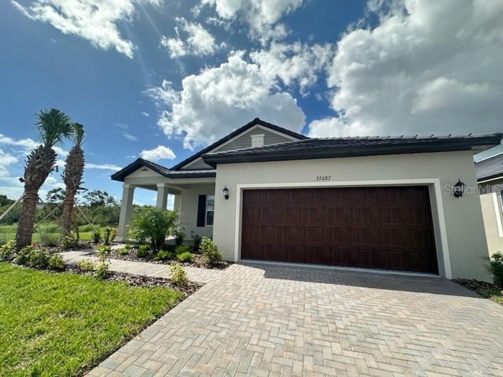 Photo of 32087 Griffin Sands Ln, San Antonio, FL 33576 (MLS # TB8433050)