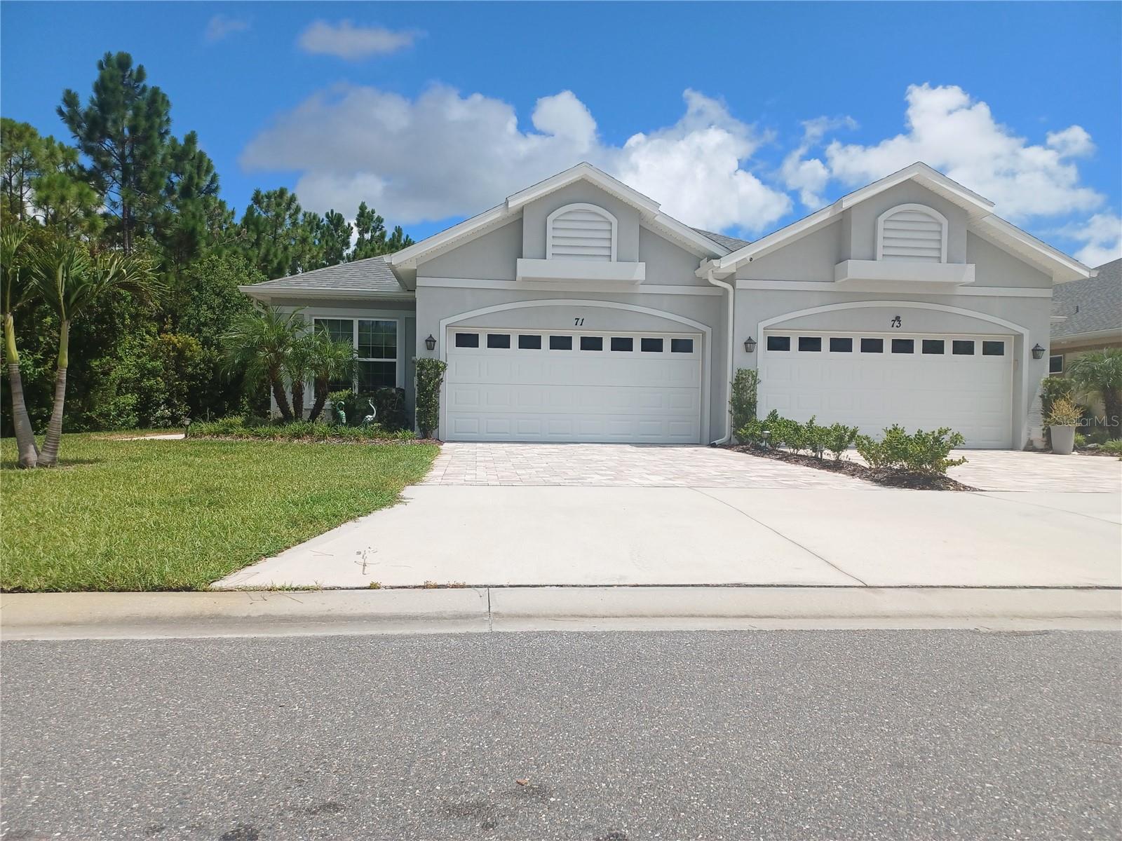 Welcome to Huntington Village a community within Hunters Ridge. This is an over 55 Community that offers many activities. This is a two bedroom, 2 bath, 2 car garage, energy efficient villa, in move in condition on a premium lot. Enjoy your morning coffee on the screened lanai looking out at the pond and see some of the beautiful birds Florida has to offer. Tray ceilings in bedrooms, Great Room and Dining Room. Beautiful kitchen with 42" cabinets, backsplash and Granite countertops. The kitchen and Great room have lots of ceiling recessed lighting. There is even a flex room that could be your office or craft room. The Primary Bedroom offers a large walk-in closet, and the Primary bath has dual sinks, very large walk-in shower, high vanity, Quartz countertops, large linen closet and private toilet area. All flooring is wood look porcelain tile planks. Primary bath has beautiful large, pieced porcelain tile. The HOA fee is 275.00 per month and the CDD fee is paid every 4 months and is 235.00. Includes all outside maintenance, including exterior painting every 5 years, lawn and shrubbery care, termite bond, pest control, insurance on the villa but not the contents inside, and includes insurance on the roof. Also includes high speed internet and cable. The amenities include, pools, Clubhouse, fitness center, tennis, basketball court and yes bring your golf cart. Close to the beach, fine dining, shopping, hospital, Daytona International Speedway, airport and more. Very well-kept community and very desirable community. You can also use all the additional amenities that are in Hunters Ridge. Come take a look at all this one owner villa has to offer.