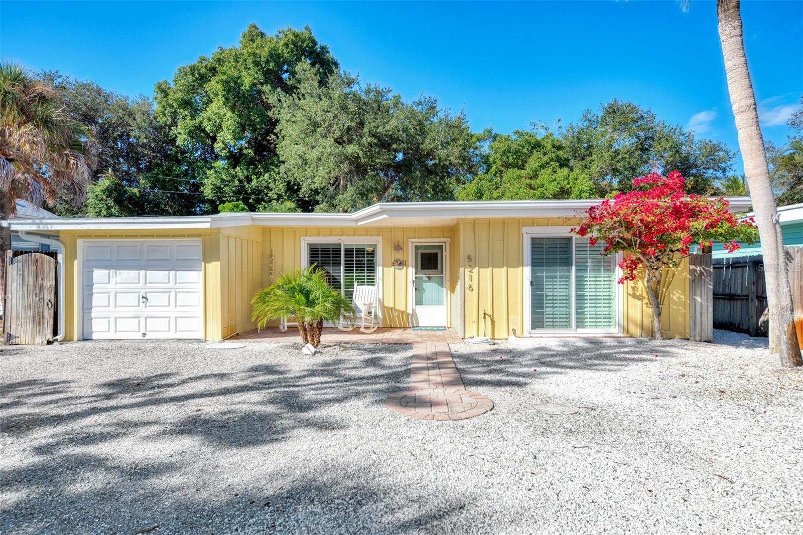 Listing reflects peak season rate. Available peak season months: January 2026, February 2026, March 2026, April 2026. Imagine a place where the warm sunshine beckons you to relax, unwind, and truly escape the everyday. Welcome to House of the Sun, a delightful 3-bedroom, 2-bathroom island bungalow meticulously designed for your ultimate Siesta Key retreat, perfectly located just a leisurely stroll from the vibrant Siesta Key Village (packed with shops, restaurants, and entertainment!) and a short walk to the world-famous Siesta Key Beach, consistently ranked #1 in the USA! From the moment you step inside, you'll be embraced by a cozy, comfortable atmosphere and tasteful coastal decor, instantly making you feel at home in your personal island paradise. The updated kitchen is fully equipped for making meals or entertaining, and the formal dining room offers serene views of the tropical backyard where you can dine al fresco or simply soak up the sun in this quiet, family-oriented haven. With a comfortable Queen bed in the primary, two Twin/Single beds in the second bedroom, and a versatile Daybed Sofa in the third, there's space for everyone. This is the tranquil, sun-kissed escape you've been longing for, a perfect place to create unforgettable memories – your Siesta Key adventure awaits!