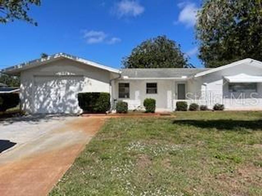 This charming 2 bed, 2 bath 1 car garage home is located in Jasmine Lakes and is clean as a whistle!  Sparkling terrazzo floors, lots of light and freshly updated. Over 1,300 sq ft and a flexible floor plan!  Living room and dining area plus a bonus room that can be an office or 3rd bedroom. Eat in kitchen and split bedroom floor plan. There is a sprinkler system too! Call today for your private tour!