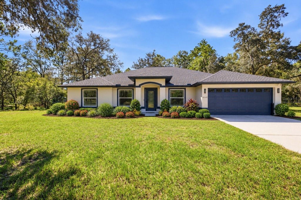 Photo of 10149 Rockbay Road, Brooksville, FL 34601 (MLS # TB8554977)