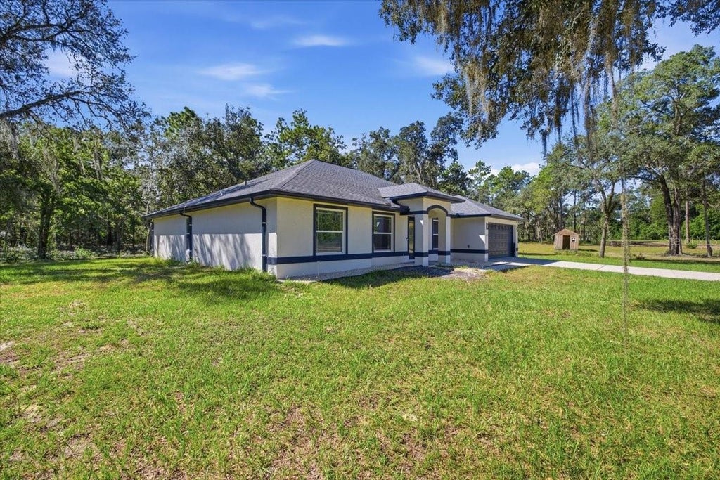 Photo of 10149 Rockbay Road, Brooksville, FL 34601 (MLS # TB8554977)