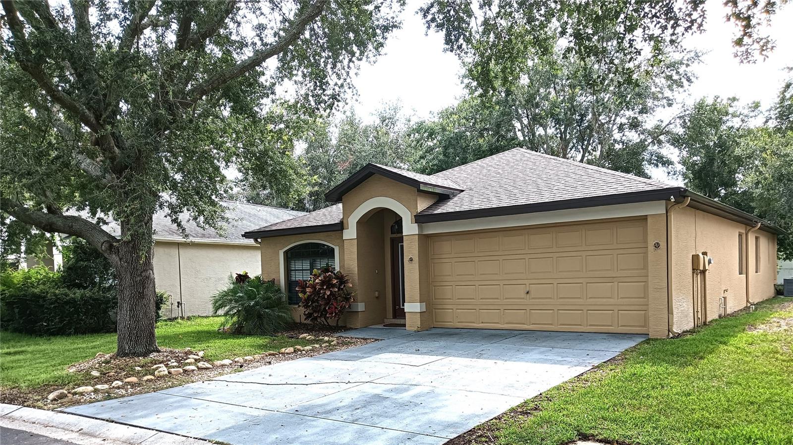 This beautiful and well-maintained home is located in the highly desirable gated Windsor Place community. With a versatile floor plan that offers 4 bedrooms or 3 bedrooms plus a den/office, this home caters to various needs. The spacious layout includes a covered and screened-in lanai, perfect for relaxing and enjoying your morning coffee. The backyard is expansive, providing ample space for outdoor activities. Inside, you'll find ceramic tile in strategic areas and laminate flooring in the bedrooms. The kitchen boasts Corian countertops, a side-by-side refrigerator with an ice/water dispenser, a flat-top stove, a built-in microwave, and a pantry closet. The living room and primary bedroom feature vaulted ceilings, adding to the airy and open feel of the home. The primary bedroom also includes a large walk-in closet. Additional features of this home include an inside laundry room, plant shelves, tile in the living room area, and laminate wood-look flooring in all four bedrooms. The home is situated in a desirable community with access to a community pool, trash pick-up, and electronic gate entry. You’ll be ideally located just minutes from schools, shopping, and the stunning beaches of Florida. Nature lovers will appreciate the proximity to Starkey Ranch and Starkey Wilderness Preserve Park for outdoor recreation. For those needing easy access to the surrounding area, Downtown New Port Richey is just 15 minutes away, with convenient access to the Tampa Veterans Expressway, only 20 minutes away, and Tampa International Airport just 45 minutes from your doorstep. This home offers the perfect combination of tranquility, privacy, and convenience. Schedule a showing today and see it for yourself!