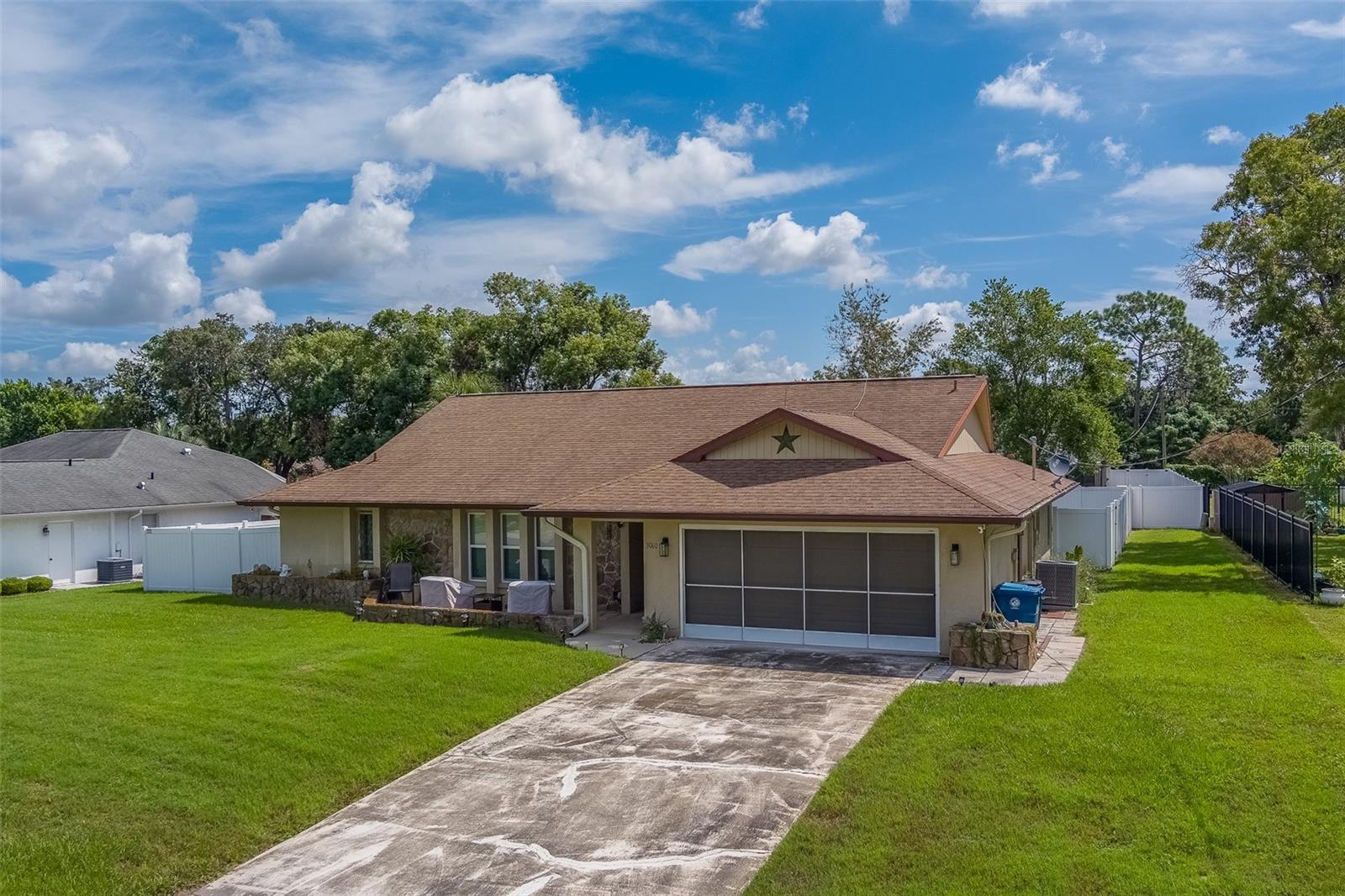 Welcome to 3060 Ardenwood Drive, Spring Hill, FL 34609! This inviting and well-maintained residence offers the perfect blend of comfort, functionality, and value in one of Hernando County’s most desirable areas. Situated on an oversized 0.27-acre fully fenced lot, the property provides both privacy and space for everyday living, entertaining, and outdoor enjoyment. A large shed in the backyard conveys with the sale, giving you plenty of storage for tools, hobbies, or seasonal décor.
As you step inside, you’ll immediately notice the pride of ownership. The home features ceramic tile flooring throughout, creating a clean and cohesive look that is both durable and easy to maintain. The layout is thoughtfully designed, offering a spacious and comfortable flow from room to room. The sizeable sunroom/Florida room extends your living space and is ideal for enjoying morning coffee, afternoon relaxation, or hosting gatherings with friends and family.
The kitchen is generously sized and designed for both function and style. With plenty of counter space and cabinetry, it flows seamlessly into the formal dining area, making this a home that’s perfect for entertaining or everyday meals. The spacious primary suite is a standout feature, boasting an oversized en-suite bathroom and ample closet space, ensuring a private retreat at the end of the day.
Important updates bring peace of mind: new windows were installed in 2021, a new HVAC system in 2023, and a new water heater in 2024. These major improvements ensure efficiency, comfort, and reliability for years to come. The roof, installed in 2004, has been well maintained. Together, these updates make this property move-in ready and an excellent choice for buyers looking for quality and value.
Outside, the oversized lot provides endless possibilities. Whether you envision a garden, play area, outdoor kitchen, or simply a private yard for relaxation, the fully fenced backyard is ready to accommodate your lifestyle. The storage shed adds convenience, and the overall setting offers both charm and function.
With its spacious feel, excellent floor plan, and meticulous upkeep, this home checks all the boxes for today’s buyer. Whether you’re a first-time homeowner, downsizing, or seeking a comfortable Florida retreat, 3060 Ardenwood Drive is an opportunity not to be missed. This home is attractively priced based on its condition and current market trends, giving buyers confidence that they are securing real value in today’s market.
Schedule your showing today and experience firsthand all that this property has to offer!