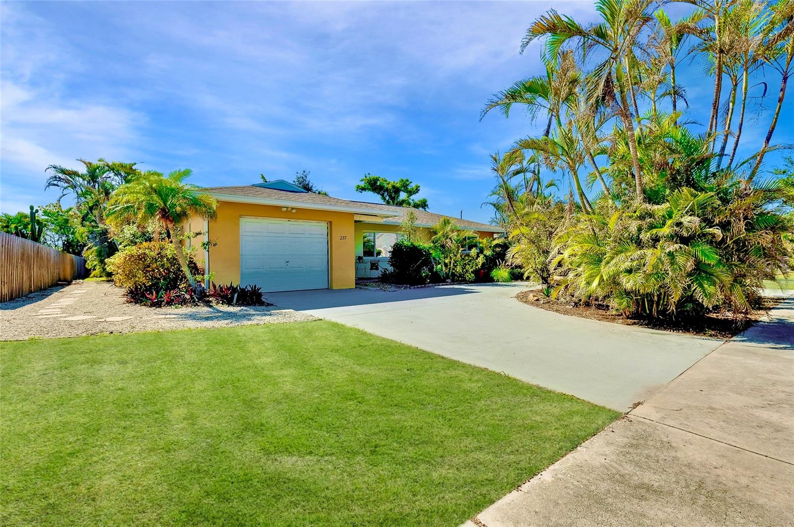 Charming Venice Island Pool Home! Discover this 2 bedroom, 2 bathroom coastal gem situated on a spacious quarter-acre lot located in the heart of Venice Island. Arrive to a circular driveway that provides abundant parking for you and your guests. Step inside to a welcoming open-concept layout, where the living room/dining room combo is filled with natural light from large front windows and sliding doors leading to the outdoor lanai. The galley kitchen is both functional and polished, featuring plentiful cabinetry and countertop space, recessed lighting, breakfast bar, and a classic trey ceiling accent. Designed with comfort and privacy in mind, the home has a split-bedroom floor plan, offering an ideal layout for homeowners and guests alike. The primary bedroom is a tranquil retreat with a built-in closet, timely vanity or dressing table, and en suite bathroom. The primary bathroom has a garden tub and shower combo, medicine cabinet, and a vanity sink with storage. Step outside to an extensive covered lanai that's great for dining, lounging, and enjoying the Florida lifestyle year-round. The focal point of the backyard is the sizable heated pool with a built-in bench feature, surrounded by decking and enclosed in a pool cage for convenience. The vast green backyard presents endless possibilities, whether you envision a garden, shed, or simply appreciating the open space. The home has been meticulously maintained and updated, including: 2023 Roof with hurricane clips, New 2025 Pool Pump and Heater Motor, New 2025 Pool Cage Screen, 2023 Water Heater, 2024 Gutters (front of home only), and 2023 Windows. Additional home highlights include X Flood Zone and Turnkey Furnished. Home is less than a mile from Historic Downtown Venice, and minutes from multiple Gulf beaches such as Brohard Beach, South Brohard Beach and Paw Park, Caspersen Beach, and Venice Beach. Home is also in close proximity to shops, restaurants, Venice Theatre, Venice Community Center, Venice Public Library, Venice Hospital, Golf Courses, parks, Legacy Trail, Venice Art Center, Venice Performing Arts Center, and many other appealing destinations. Don't miss this opportunity to experience the desirable Florida lifestyle!