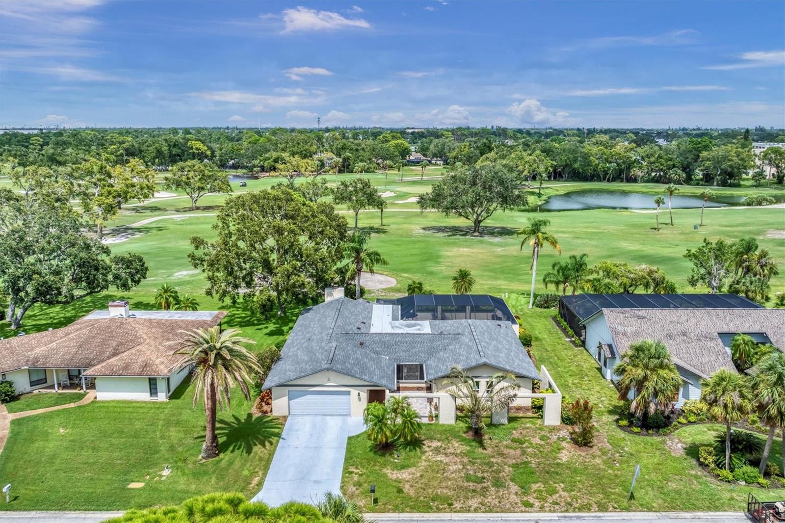 **Owner is working on improving front landscaping** Situated on the 10th fairway of the IMG golf course, this beautifully updated 3-bedroom, 3-bath home in the Fairways at El Conquistador offers one of the community’s most coveted locations, with expansive golf course views from nearly every rear window as well as the screened lanai. The open-concept layout features soaring ceilings, impact-resistant windows and sliding doors, and a spacious great room with a fireplace, offering a warm and welcoming ambiance. The kitchen is a chef’s dream with brand-new stainless steel appliances and a new Monogram dual-fuel gas cooktop and electric oven. The primary suite features sliding doors to the screened lanai and a spa-like bath with dual sinks and two showers. Relax on the large, screened lanai boasting an oversized pool and stunning fairway views. Recent upgrades include a new roof (2021), an upgraded drainage system, new pool cage roof, screen door, and rescreened surround. Patio furniture conveys, including the 85" lanai TV. Additional highlights include a laundry room, custom garage shelving, and Hunter Douglas blinds throughout, including wireless-operated slider door coverings. Ideally located just down the road from IMG Country Club, IMG Academy, shopping, dining, and SRQ Airport, with the beautiful sugar sand beaches of Anna Maria Island just a short drive away.
