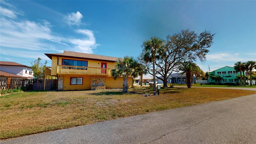 Sunset and water views from just about every upstairs window and balcony are found in this home on Bouchelle Island, a beautiful riverfront community with custom homes.  This is a 3/3 on a large corner lot with plenty of room for a pool!  Downstairs private space with bathroom, laundry room and 3/2 upstairs.  New A/C, gutters and soffits.  Roof 2016. Ride your bike to the beach and historic Flagler Ave with its great restaurants and shops! 
 *NEW FRONT DOOR AREA IS BEING INSTALLED** ;Water: City