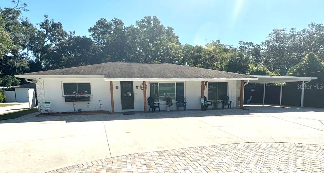 Say goodbye to subdivisions and city life. Peaceful semi-rural area. Close to all convivences, shopping and the area amenities. This beautiful home and property, with it’s own detached guest apartment is very unique. Situated on a large, landscaped fenced lot, just under ½ acre. No HOA. No Deed Restrictions. No Flood insurance required. Nice circular driveway with a huge area for guests to park. No water and sewer bills ! Own your own private well and two private septic systems. Be self-sufficient. Perfect for the largest of families that love to entertain, and would like to offer their friends and guests their very own private accommodations for their visit ! The main home boasts 5 bedrooms and 3 full bathrooms. There are two individual private Suites. One Suite has two bedrooms, the other Suite with one bedroom. Both Suites have private bathrooms, refrigerators, sinks with snack preparation areas, separate AC/Heat systems and private entrances. Great floor plan for guests, teenagers or College kids living at home ! There are also two additional bedrooms with a third full bathroom in this home’s split bedroom floor plan. With one additional door added, this could be a third private Suite. Nice open great room floor plan. Spacious, totally renovated “eat-in” kitchen at the center of the home that’s open to the living room. Large indoor laundry room. The back porch is great for BBQing and entertaining, and it overlooks a large backyard with a fire pit for great night time gatherings. There’s also an outbuilding that once was used as a potting shed and greenhouse. The main home is licensed for an “AirBnB” short term rental, and has been quite the income producing investment for the owner. For vacationing friends and family, or for an elderly parent that needs to be close … there is also a new detached Guest Apartment on the back of the property, with a separate long private paver driveway. With its own private fenced yard to include a private laundry area. The Apartment is currently being used as a private Office by the owner. The Apartment construction was permitted (June 2024) and completed only about a year ago. There are too many extras and features about this property to list here. Looks interesting ? You really need to see it in person. Call the Listing Agent today for a private showing.