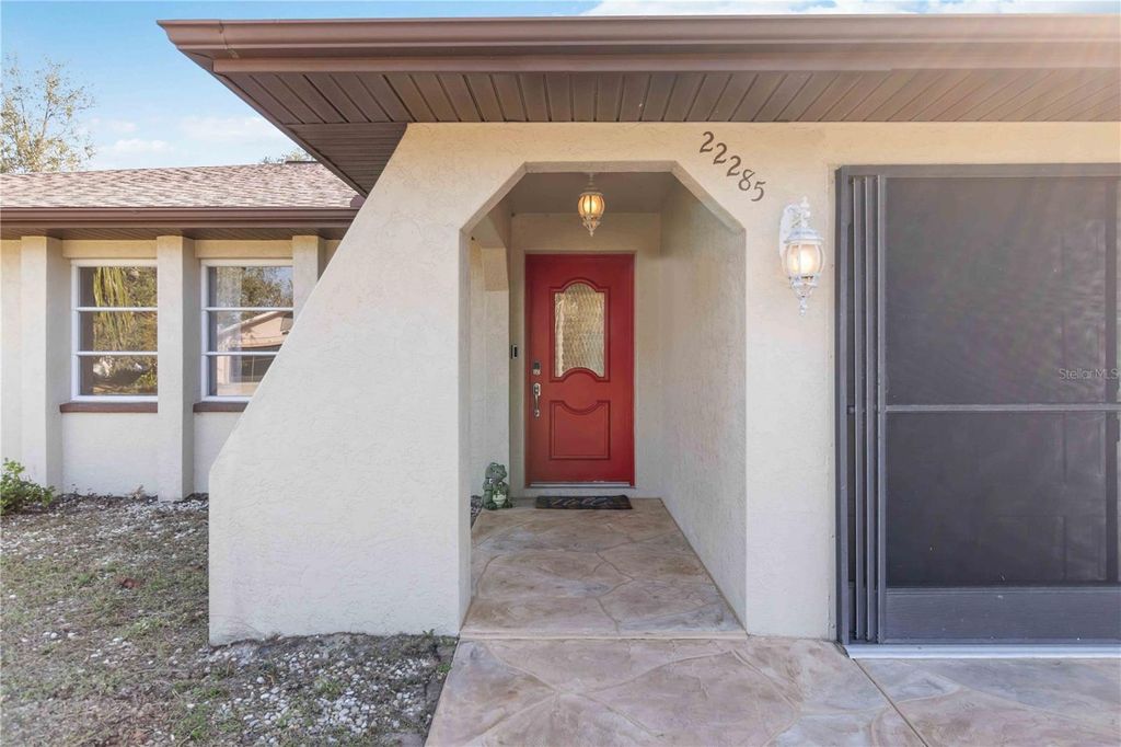 Photo of 22285 Walton Avenue, Port Charlotte, FL 33952 (MLS # OM719642)