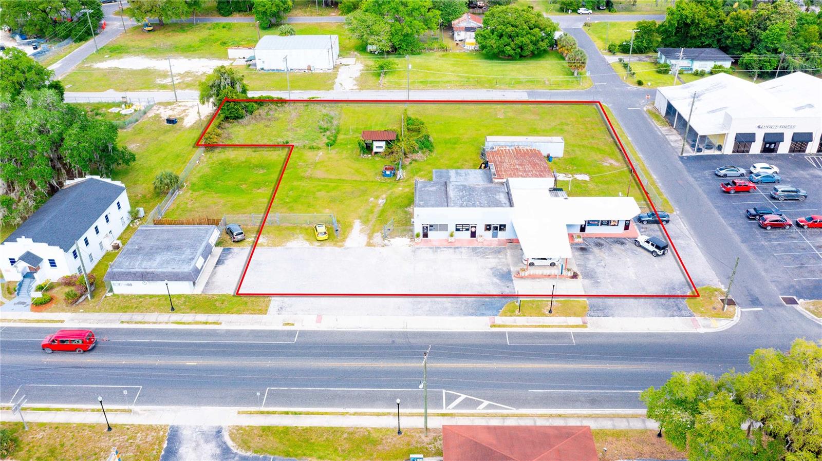 Prime Downtown Dade City Investment & Leasing Opportunity. Situated in the heart of historic Downtown Dade City, this 1.15-acre parcel offers unmatched visibility and access, with street frontage on three sides and an impressive 200 feet along bustling 7th Street.
The property features a 3,103 SF retail building, currently home to two established tenants, providing steady income. In addition, two units (with potential for a third) are available for lease, making this an ideal opportunity for investors seeking both immediate cash flow and future upside through lease-up potential. With its strategic location, ample street exposure, and rare parcel size for downtown, this property is well-suited for retail, restaurant, office, or mixed-use concepts. The surrounding area continues to thrive with strong foot traffic, local businesses, and community events that make Dade City a regional draw.