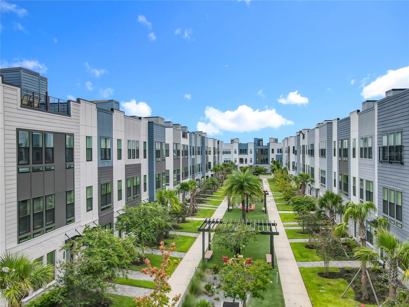 Rare Opportunity at The Brix at The Packing District! This exceptional 4-story luxury townhome offers 4 bedrooms, 3.5 bathrooms, a private rooftop terrace with panoramic views, a custom-built brick summer kitchen—perfect for entertaining. Available now and move-in ready.
Situated at the center of the community courtyard, this newly constructed residence showcases high-end finishes, including wood flooring throughout the bedrooms and stairs, iron rod stair railings, custom window blinds, and blackout curtains in the primary suite.
The first floor includes a private room, closet, and full bathroom—ideal as a home office, yoga/fitness room, or in-law suite.
The second floor features a gourmet kitchen with gas stove, stainless steel appliances, cabinetry and pantry, family room with guest bathroom.
On the third floor, you’ll find the spacious primary suite with a private en-suite bath, two additional bedrooms, a full secondary bath, and a conveniently located laundry room.
A two-car garage with additional storage space adds practicality to this luxury home. Two EV connectors inside, one on each side of the garage. Enjoy low-maintenance living with access to premium community amenities: a dog park, children’s play area, Foxtail Coffee, Great Southern Box Food Hall, 4Roots Farm, 1.5-mile walking and biking trail, green recreational areas, the amphitheater, the Orlando Tennis Centre, and the YMCA—all just steps away.
The home includes 78,000 in builder upgrades by Toll Brothers, plus an additional 29,000 in post-closing custom improvements by the owner—offering exceptional quality and value.
Seller is offering up to 20,000 in buyer credit with a full-price offer, which may be applied toward closing costs, interest rate buy-down, down payment, or price reduction—as applicable and subject to buyer’s lender approval.
This is a rare opportunity to own a fully upgraded Citrine Modern II Model and save thousands—book your private showing today before it's gone!
