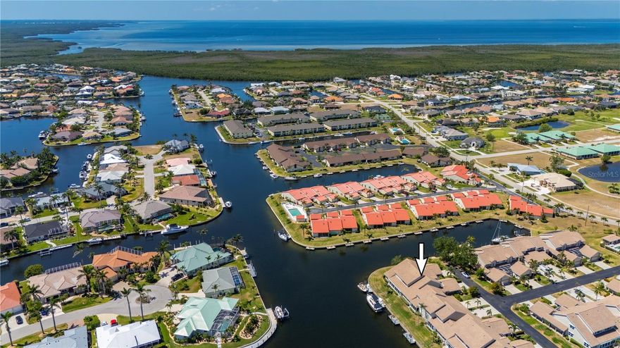 The time is now to own your slice of paradise in PUNTA GORDA ISLES! This updated waterfront townhouse-style condo offers boater’s dream living with intersecting canal views and quick sailboat access to Charlotte Harbor — just 12 minutes through Buckley’s Pass.

Located in the highly sought-after Harbor Landings community, this 3-bedroom, 2.5-bath home with loft is perfectly positioned at the quiet end of a charming, lamplit street with long water views. Enjoy cathedral ceilings, abundant natural light, and beautiful updates throughout.

Your deeded dock with water & power (both dedicated 30 amp and regular 20 amp) accommodates boats up to 37 feet and lifts are HOA-approved should you like to add one. Inside, find a bright and open floor plan, new carpet (2025), hurricane-resistant windows, new garage door (2023), and new sun-tinting (2025) on the sliders for year-round comfort. The updated kitchen features solid wood cabinets, granite countertops, a breakfast bar, and two built-in workstations.

The romantic courtyard lanai off the primary suite is a private oasis with in-ground whirlpool spa, lush tropical landscaping, and decorative fireplace—perfect for relaxing or entertaining. Upstairs, the loft offers waterfront views, ideal for a home office, gym, or creative space, plus two guest bedrooms with a Jack-and-Jill bathroom.

Enjoy the four-season sunroom with built-in Jenn-Aire grill, electric roll-down shutters, and new tile roof (2023). Harbor Landings residents also enjoy a heated community pool, restrooms, and beautifully maintained grounds.

Located close to everything Punta Gorda is famous for—St. Andrews South Golf Club, Isles Yacht Club, fishing and boating clubs, pickleball and tennis, farmers markets, restaurants, and the downtown waterfront district. Grocery shopping and daily conveniences are just minutes away.

Live the Gulf Life today—schedule your showing and discover why Punta Gorda Isles is one of Florida’s premier boating and waterfront communities!