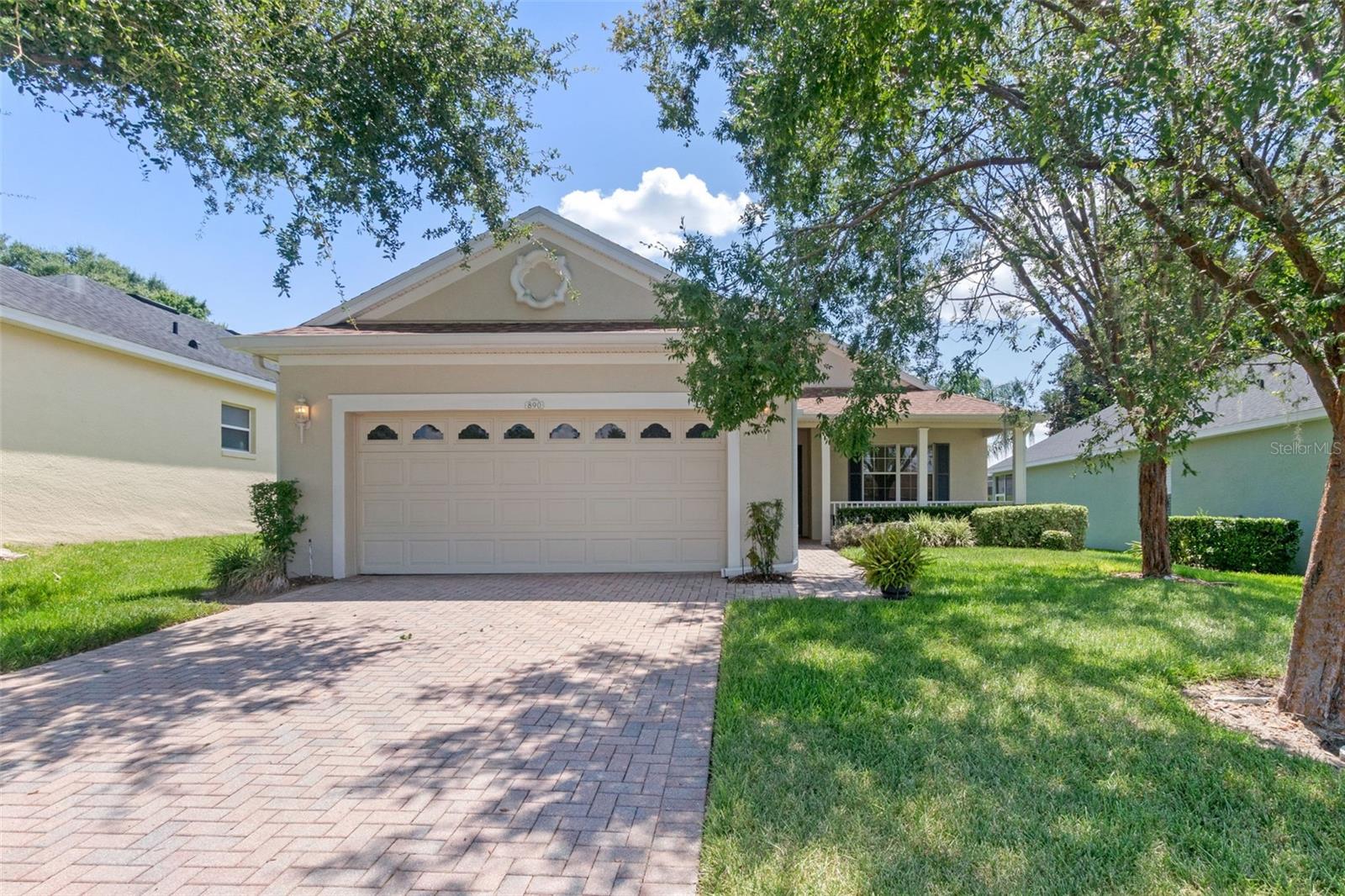 Welcome to 890 Summit Greens Boulevard! Enjoy resort style living in the active & highly sought after 55+ Golf Community of Summit Greens. Your new home offers impeccably maintained curb appeal with a paver driveway, lush landscaping & views of the community golf course. This move-in ready home offers you 3 full Bedrooms & 2 full Bathrooms. Fully appointed & upgraded kitchen (2021) with new 42" cabinets, Quartz countertops, beautiful backsplash & Stainless Steel Appliances. Your dining nook offers built in cabinet storage along w/ample space for a small dinette. The Family area offers views to the expansive 25" long lanai with privacy & entertaining opportunities. The Primary Suite is tucked towards the back with no rear neighbors & a newly upgraded en-suite appointed with Quartz Dual Sinks, soaking tub & walk in shower. The conveniences of this home are endless with neutral paint throughout, newer carpeting, two generous additional bedrooms & a 2nd bathroom (also with an upgraded quartz sink). Enjoy the Florida winters with this well appointed home & no worries. Roof (2021), HVAC (2021). You are a golf cart ride away from the Clermont Favorite - Clermont National Golf Course which offers nighttime fun, daytime activities for all & all of the conveniences that Clermont offers. Minutes to the Turnpike, Shopping, Hospitals & Restaurants.