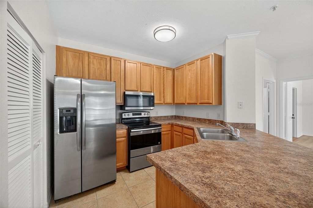 Photo of 10103 Courtney Oaks Circle #204, Tampa, FL 33619 (MLS # TB8440728)