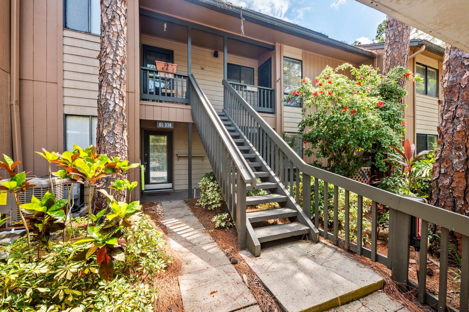 This second floor 2 bedroom/2 bath Glenhouse condo has an abundance of light due to two installed sky-lights in the living room. This condo is walking distance to the Pavilion and pool. The main living area overlooks a private preserve, providing the sought-after Florida indoor/outdoor lifestyle. The two installed sky lights in the living room contribute to the light/brightness of the inside of condo.  This condo is located within Pelican Cove, one of Sarasota's most popular gated, waterfront complexes. It's a short walk from the front door to the most picturesque of the six heated pools, tennis courts and other amenities. The marina offers 85 slips for sailboats and powerboats up to 40 feet with direct access to the Bay and ICW. For quiet watersport lovers there are storage racks and launches for kayaks, canoes and paddleboards. Six heated pools, three clubhouses, tennis and pickle ball courts, gym, yoga classes, music series add to the resort lifestyle. Well-equipped woodwork shop, art studios, PC University and many resident-run recreational clubs and activities. Pelican Cove is very dog friendly and allows 2 dogs without size restriction. This community is very well-managed with on-site management office. Pelican Cove is in a very convenient and central Sarasota location close to Downtown, beaches, dining, restaurants.
