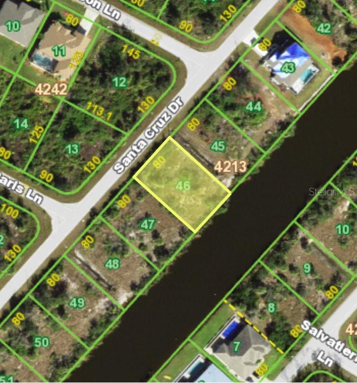 Discover the perfect waterfront lot in the heart of South Gulf Cove! This vacant parcel not only features a rare concrete seawall, but also places you right in a vibrant waterfront community. South Gulf Cove offers a unique lock system, allowing boaters to navigate from the freshwater canals out to the Myakka River and into Charlotte Harbor with ease. With playgrounds, parks, sidewalks, and city utilities all at your fingertips, this lot is a prime opportunity to create your own waterfront retreat. It’s a straightforward canvas with all the essentials, ready for your vision.