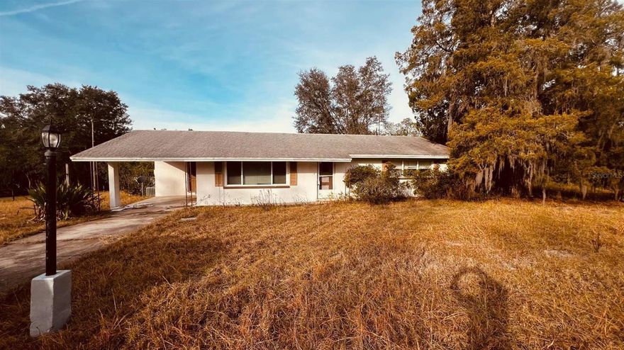 This is a truly a unique property in Rainbow Lakes Estates that features two separate single family homes, an in ground screened pool, a large detached workshop, and about 1 acre of land. Main home is a 3/2 with an attached carport and screened in-ground pool. Back home has a separate address (4450) with 1 bedroom, 1 bathroom, an attached carport, a kitchen, a separate electric meter, and a separate driveway. No Flood Zone. Near Lake Bonable where you can take your small boat out and fish. Community offers clubhouse, fitness center, shuffleboard, parks, groups, and more for all residents. Property needs lots of repairs and restoration. Buyers are encouraged to do all due diligence and complete inspections prior to placing an offer.