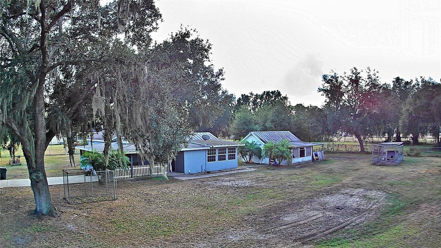 Welcome to this well-kept 3-bedroom, 2-bath home on 5528 Cherry Dr. in North Lakeland, offering the perfect blend of character, space, and privacy. Set on almost an acre and a half, this property gives you the freedom to spread out while still being just a short drive from town conveniences. Bring your chickens, bring your animals—there’s plenty of room for everyone.Step inside to find a clean, lovingly maintained home with an easy-flow layout. While not fully updated, the home has been thoughtfully cared for and is ready for you to move right in. The interior features inside laundry and a comfortable air-conditioned bonus room ideal for a playroom, office, gym, or additional living space.A second bonus room overlooks the expansive backyard and includes a built-in firebox, making it a cozy spot to relax year-round.Outdoors, you’ll enjoy a workshop, fenced areas for animals, and all the space you need for gardening, hobbies, or simply enjoying the peaceful setting. Whether you’re looking for a mini-homestead, a place to spread out, or a home with charm and possibility, this property is ready to welcome you.