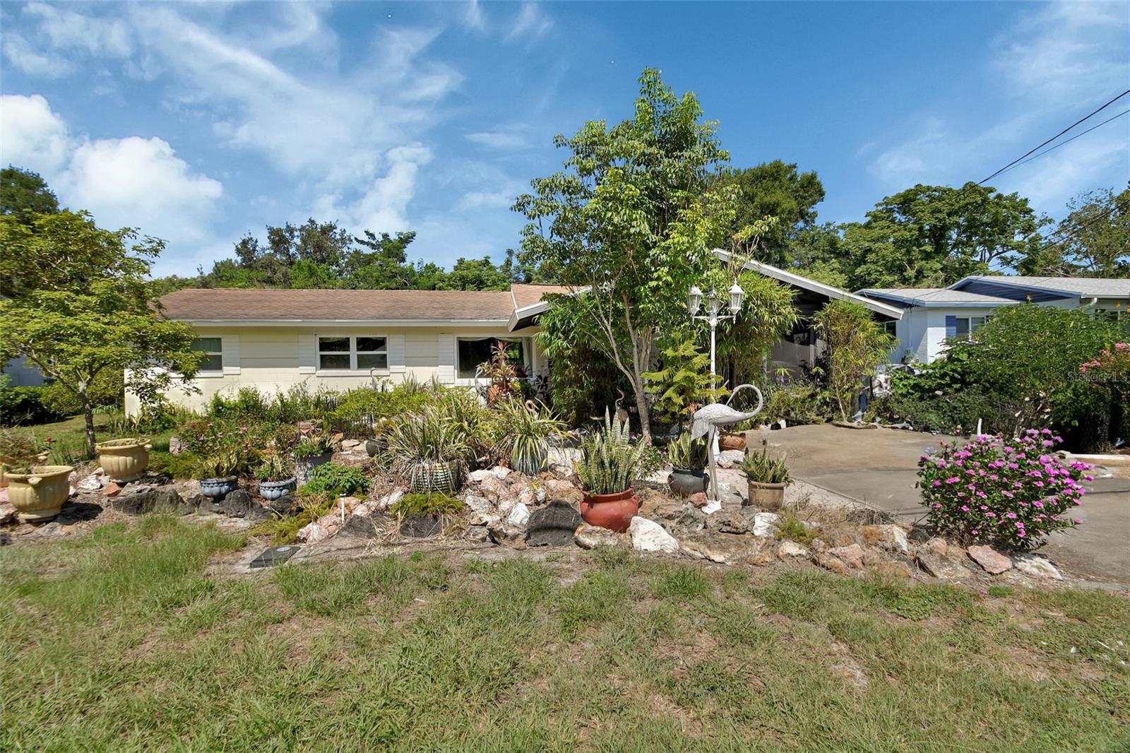 Bring your vision to 218 S Ridgewood! This 3-bedroom, 2.5-bath home sits on nearly a ¼-acre lot in a prime location just minutes from SunRail—perfect for commuters and anyone who values convenience.
Inside, you’ll find hurricane-rated windows and doors (2019), an AC replaced in 2020, and a re-piped system for added peace of mind. A private atrium off the primary bedroom offers a sunny spot for morning coffee or plant lovers alike.
The vaulted ceiling screened porch at the front of the home, finished in wood-look tile, makes a welcoming retreat surrounded by greenery—ideal for relaxing or dining outdoors. The yard provides plenty of space to play or garden.
While this home needs some TLC and updates, the updates already in place make it a fantastic opportunity to create something special. Priced at $229,000, it’s ready for your personal touch.