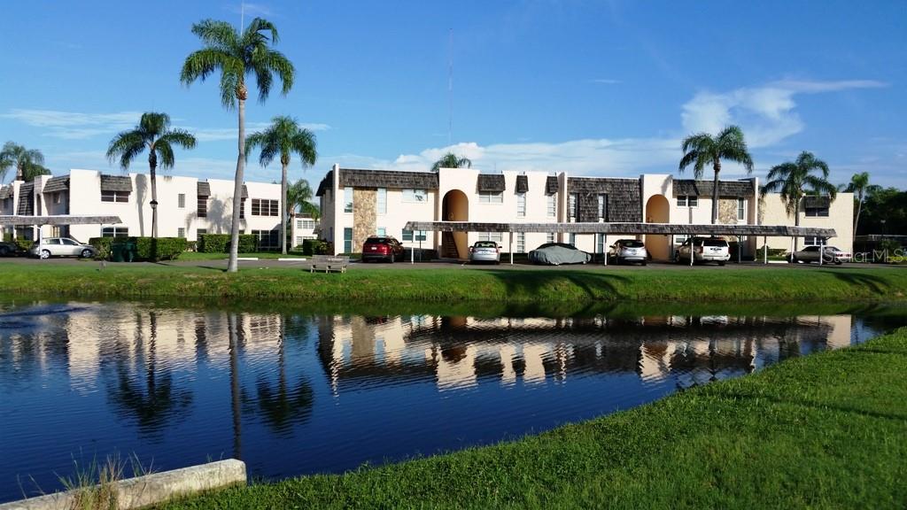 Welcome to The Gardens, a highly sought-after, pet-friendly 55+ community nestled among tree-shaded grounds and just steps from beautiful Lake Seminole Park. This spacious 2-bedroom, 2-bath corner unit offers over 1,280 sq ft of light-filled living space and overlooks a serene pond—creating a peaceful and private retreat you’ll love coming home to. Located on the second floor, this furnished residence features numerous updates throughout, including a refreshed kitchen and updated baths. Large windows invite in natural light, enhancing the warm, welcoming feel of this home. Enjoy resort-style amenities just steps from your door: a heated pool, a newly remodeled clubhouse, and an updated laundry room. Whether you're seeking a full-time residence or a seasonal getaway, this charming home offers comfort, convenience, and a vibrant community lifestyle—all just minutes from Gulf beaches, shopping, and dining. Don’t miss this opportunity—call today for your private showing!