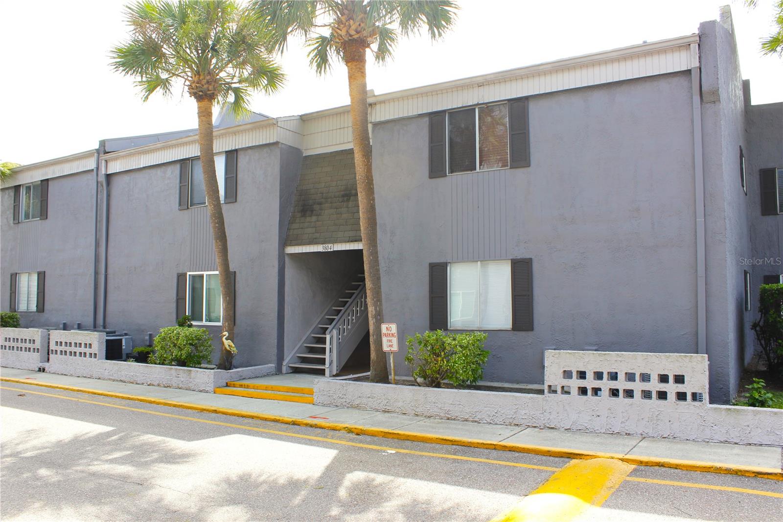 Discover this beautiful, move-in ready 2-bedroom, 1-bathroom, First floor condo in the Cortez of Carrollwood community. A bright and welcoming living room greets you upon entry and flows seamlessly to the enclosed porch, providing a cozy extra space to relax or entertain. The kitchen features granite countertops, stainless steel appliances, and a convenient breakfast bar that opens to the living area. Ceramic tile flooring extends throughout the home, adding durability and style. The primary bedroom is spacious, with plenty of natural lights and included a walk-in closet. The unit also offers inside laundry for everyday convenience. Outside, enjoy a charming exterior seating area surrounded by plants and small wooden deck, perfect for relaxing or enjoying the view. The low community fee covers water, basic cable, pool access, and grounds maintenance. Ideally located near major roads, shopping centers and restaurants.