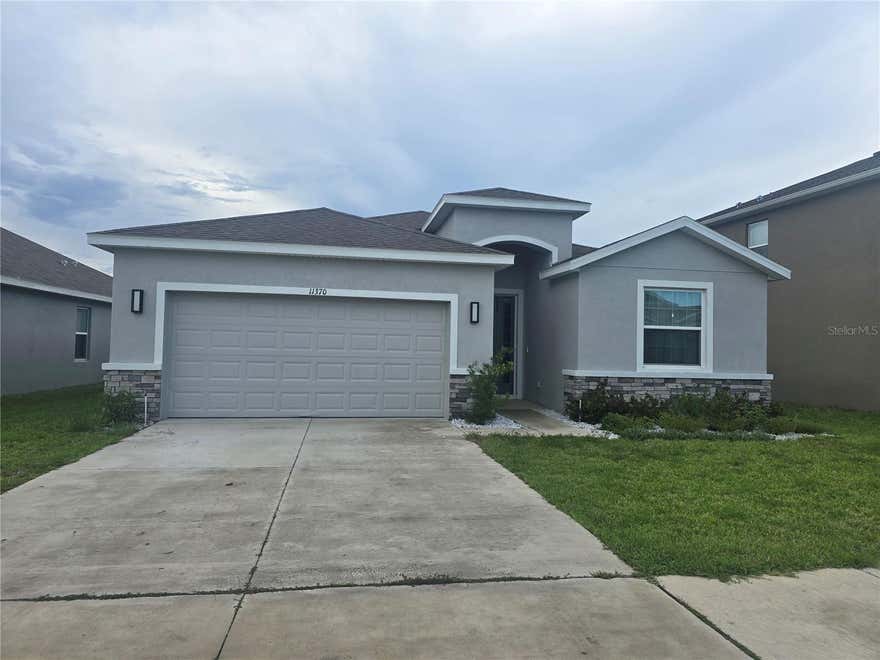 Located in the beautiful Waterford community, this nearly new 4-bedroom, 2.5 bath home built by D.R. Horton offer 2,057 square feet of modern living space and was completed in 2023. Lightly lived in and exceptionally maintained, this smart home features quartz countertops,stainless steel appliances, an open-concept layout, and stylish finishes throughout.

This spacious kitchen includes a large center island with seating and flows seamlessly into the dining and living areas, creating an ideal space for entertaining and everyday living. The private primary suite features an ensuite bath with dual vanities, garden tub, walk-in shower, private water closet, and oversized walk-in closet. Built with block construction and stucco exterior, the home also includes in wall pest control protections for added convenience.
Step outside to the covered rear patio, perfect for morning coffee or relaxing evenings and there are no backyard neighbors. For additional privacy fences are allowed. A  2-car garage  provides ample parking and storage space. With limited 4 bedroom homes available in the community, this property stands out as an exceptional opportunity in the Waterford's original phase.
Leasing is permitted, making this property attractive for both homeowners and investors  alike. Schedule your showing today and experience the lifestyle Waterford has to offer.