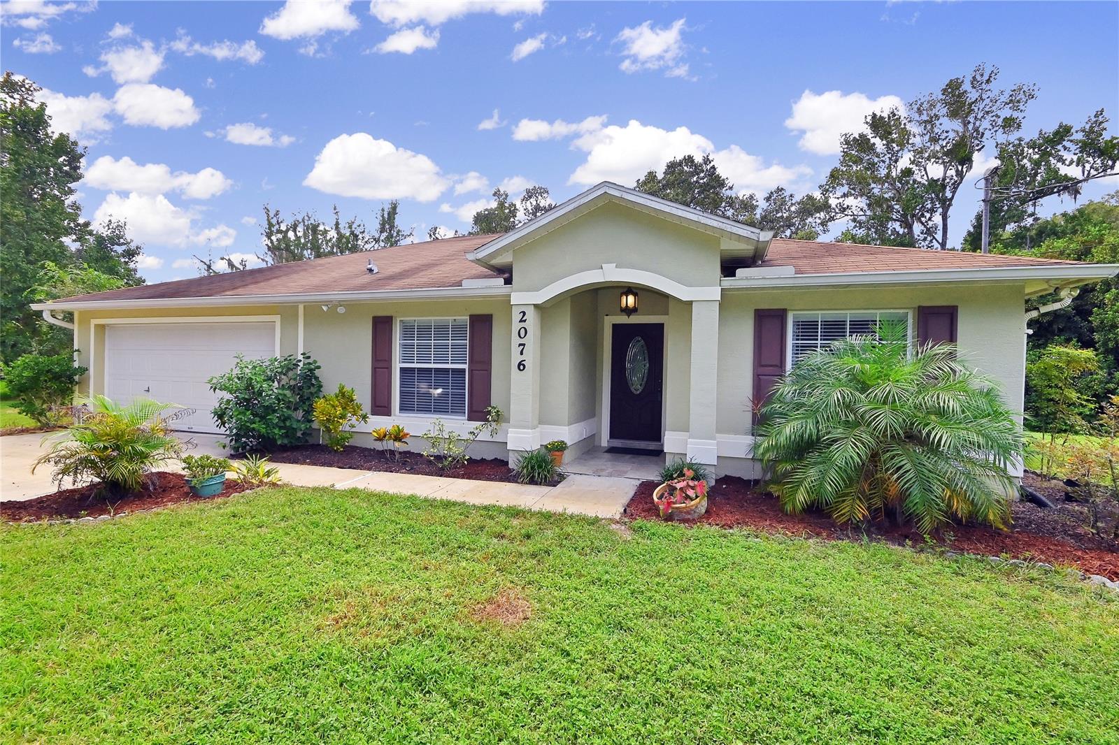 Here is the opportunity to own a newer home with ample space for horses, RVs, boats and all the pets and toys close to most major roads and minutes to the beach but with maximum privacy.
On over 2.5 acres this block home provides a spacious open floor plan with vaulted ceilings, plant shelves, large eat in kitchen with tons of cabinets for storage, designer granite counter tops and tile back splash, Frigidaire SS appliances and large pantry.
Large great room leads to huge screened porch , wooden deck and patio area all overlooking lush backyard.
The split floor plan allows for privacy and quiet times.
Workshop could easily be converted into 1-2 car garage.
Large RV metal cover holds the largest of RVs with hookups.
This property truly has everything anyone would want in a home from large families to retirees!!
A must see!!