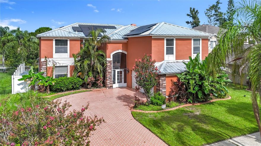 Discover the perfect blend of space, comfort, and resort-style living in this expansive 4-bedroom, 3-bath pool home offering 3,855 sq. ft. of beautifully designed living space. Step into your own private retreat featuring a screened lanai, resort-style pool, hot tub, and peaceful pond views, all set on a spacious paver patio ideal for relaxing or entertaining. Inside, the chef-inspired kitchen boasts stone countertops, stainless steel appliances, and plenty of room for cooking and hosting. The open layout flows effortlessly into the dining and living areas, creating a warm and inviting atmosphere. Upstairs, an oversized flex room provides endless versatility, perfect for a home office, creative studio, game room, or workspace. Additional highlights include a 2-car garage and energy-efficient solar panels that help keep electric costs low. Located in a quiet, well-maintained community close to shopping, dining, and major commuter routes, this home offers convenience and comfort in one exceptional package. This property is available for self-tour, view it on your schedule!