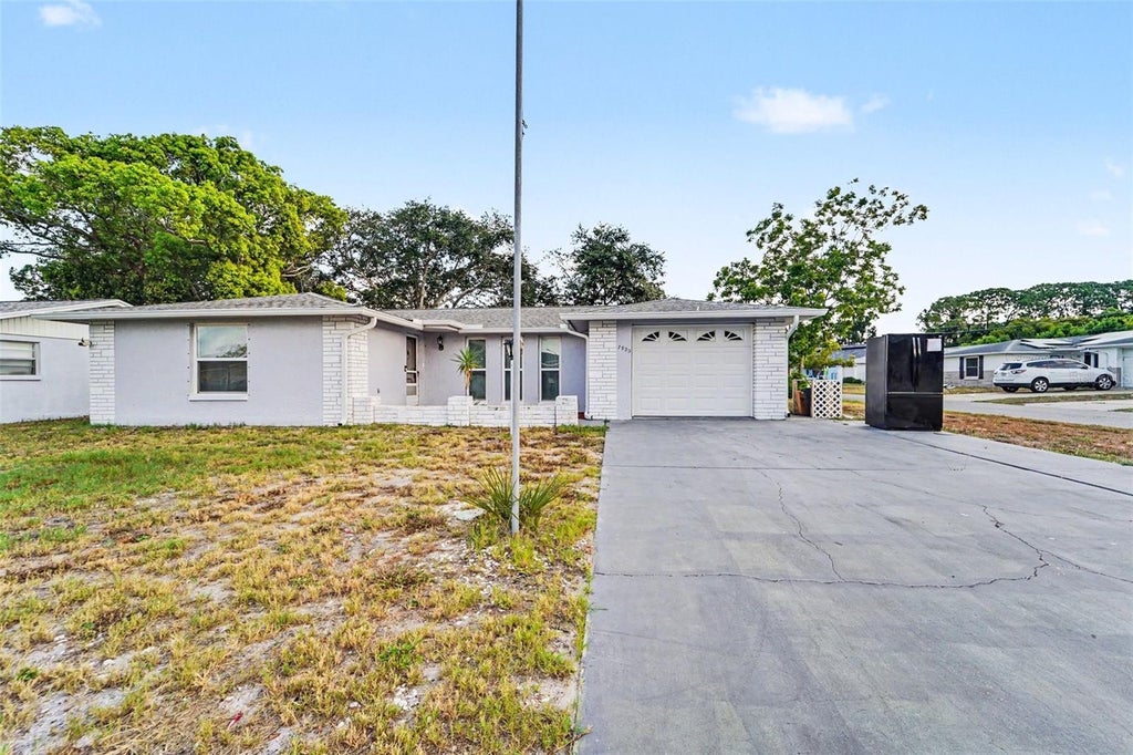 Photo of 7923 Ironbark Drive, Port Richey, FL 34668 (MLS # TB8521862)