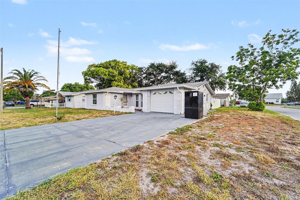 Photo of 7923 Ironbark Drive, Port Richey, FL 34668 (MLS # TB8521862)