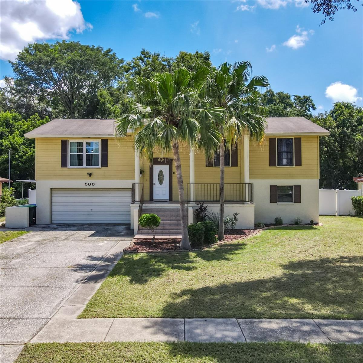 Welcome to this beautiful community of Rolling Oaks! This Split-Level home is well designed for family life. A lower level with private entrance to the backyard is great for multi-generational in-law living, teenagers, tenants, a daycare, home office, personal training gym, game room, media room, and a whole host of possibilities! Currently, there is a full bathroom, living area with an entertainment bar, bedroom with a walk-in closet. There are pipes and electrical behind the walls to easily install a kitchen. As you enter the front door, walk upstairs to the living room, kitchen, dining room, along with three bedrooms, which includes the primary bedroom with en suite and another hallway bathroom. The freshly painted eat-in kitchen boasts stainless steel appliances, under sink reverse osmosis water system, center island and pantry. The large living room has new laminate flooring, argon gas windows, fresh paint and a large 65" TV that remains with the home. The freshly painted dining room has new flooring that leads out to the deck. This spacious deck is great for summer grilling and relaxing. The large backyard has new vinyl fencing with orange and lemon fruit trees. Newer storage shed in the backyard, for all your gardening supplies. There is room in the backyard for a pool, boat or RV and there are no HOA fees. Excellent location with quick access to nearby shopping, restaurants, Wekiva Springs State Park, Hwy 436/Semoran Blvd, SR 429 and I-4! This is a wonderfully well-cared-for home and will no doubt go quickly!