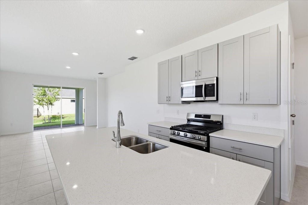 Photo of 3040 Windswept Way, Wildwood, FL 34785 (MLS # O6452024)