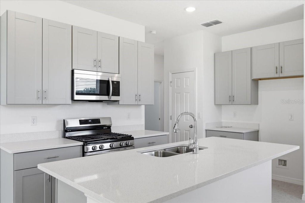 Photo of 3040 Windswept Way, Wildwood, FL 34785 (MLS # O6452024)