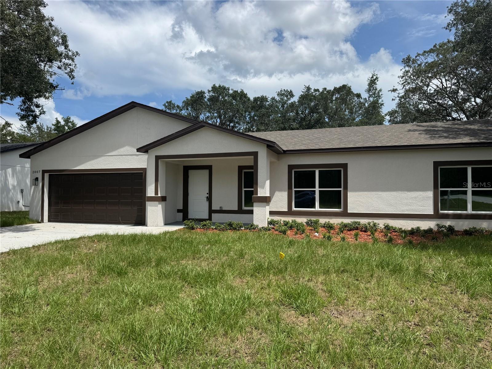 READY TO MOVE IN! ASSISTANT WITH CLOSING COST , 1 YEAR HOME WARRANTY, AND INTEREST RATE DISCOUNT POINTS ARE AVAILABLE WITH PREFERRED LENDER
Stunning New Construction –4-Bed,3-Bath Home in Citrus Springs! This exquisite 1,931 sq. ft. brand-new 4-bedroom, 3 bathroom home offers a perfect blend of modern elegance and functional design. The open-concept floor plan is filled with natural light, creating a warm and inviting atmosphere. The gourmet kitchen best countertops, sleek ceiling-height white cabinetry, stainless steel appliances, and a spacious island—ideal for both cooking and entertaining. Throughout the home, luxury vinyl plank flooring provides a seamless, low-maintenance look—no carpet anywhere! Expansive double sliding doors lead to a private backyard, offering plenty of space for outdoor relaxation, gatherings, or even future customization. A charming front balcony area adds to the home’s curb appeal, while the double-car garage provides ample storage and parking. Located in the highly desirable Citrus Springs community, this home comes with no HOA restrictions, giving you the freedom to enjoy your property as you see fit. Conveniently situated near local springs, shopping, dining, and outdoor recreation, this is the perfect place to call home. Don’t miss this incredible opportunity—schedule your private tour today!