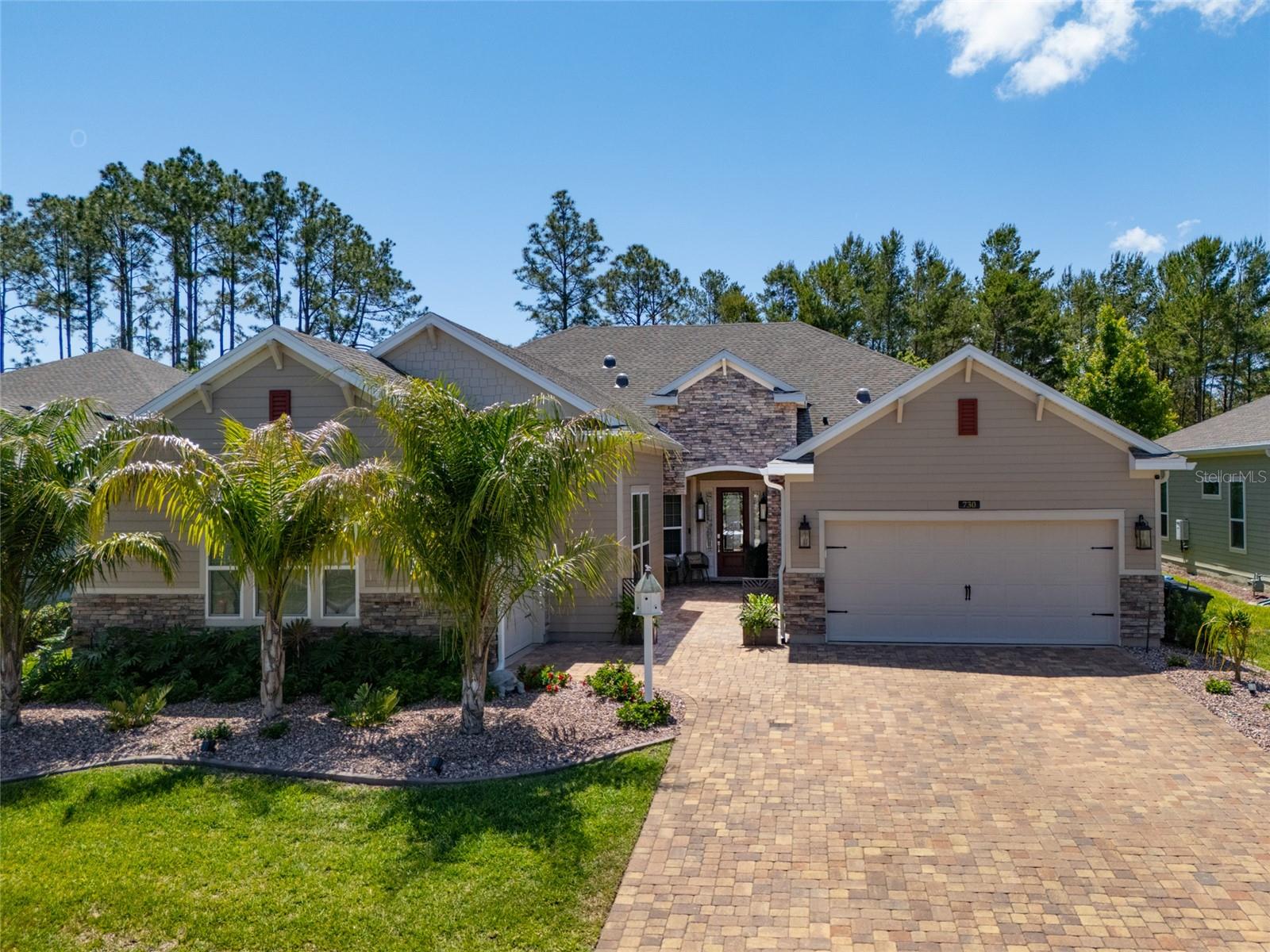 Exquisite Multi-Generational Home in Saint Augustine Florida. This home is equipped with a new whole-house generator to ensure uninterrupted power, no matter the circumstances. Location -in Palencia right in front of a park. This beautifully upgraded home offers unparalleled comfort, style, and functionality, making it ideal for families of all sizes. With 5 spacious bedrooms +office and 5 well-appointed bathrooms, this residence offers the perfect blend of privacy and open living space. The home boasts a dramatic glass front door and 8' interior doors, The spacious layout is further enhanced by new paint throughout, giving the home a fresh, modern feel. Gourmet Kitchen: The newly updated chef's kitchen is a true standout, featuring new granite countertops, a new kitchen island, and 42'' cabinets. The extended screened lanai with pavers. New plumbing fixtures throughout, iron stair railing and wood chair rails, new landscaping and new, and a new electric fireplace.